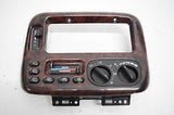 99 00 CHRYSLER TOWN AND COUNTRY CLIMATE CONTROL DASH BEZEL WOOD GRAIN