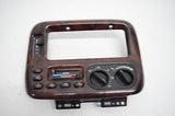 99 00 CHRYSLER TOWN AND COUNTRY CLIMATE CONTROL DASH BEZEL WOOD GRAIN